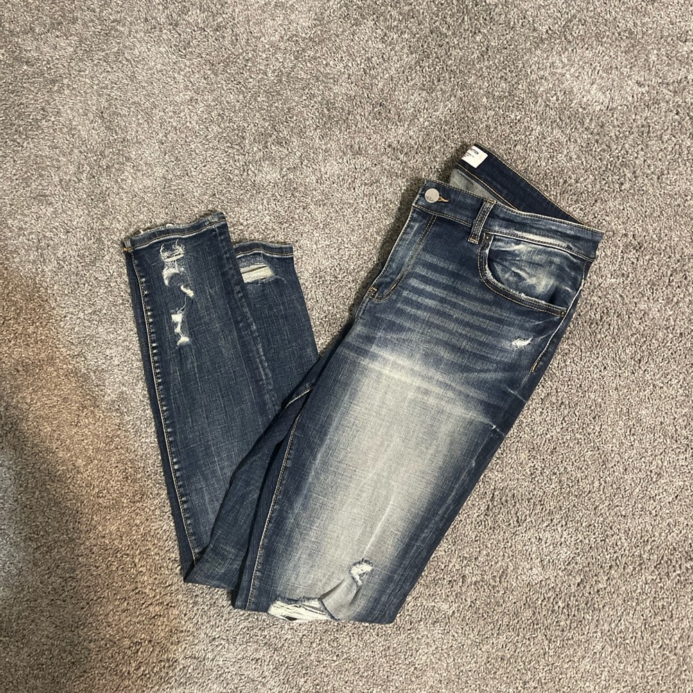 Buckle Distressed Skinny Jeans